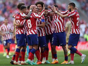 Atletico Madrid's French forward Antoine Griezmann (2nd-L) celebrates with teammates after scoring his team's second goal during the Spanish league football match between Club Atletico de Madrid and UD Almeria at the Wanda Metropolitano stadium in Madrid on April 16, 2023. (Photo by Pierre-Philippe MARCOU / AFP)