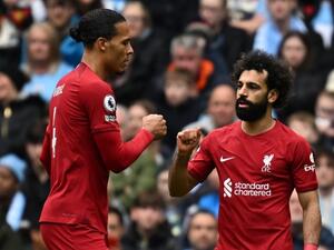 iverpool's Egyptian striker Mohamed Salah (R) celebrates with Liverpool's Dutch defender Virgil van Dijk (L) after scoring the opening goal of the English Premier League football match between Manchester City and Liverpool at the Etihad Stadium in Manchester, north west England, on April 1, 2023. (Photo by Paul ELLIS / AFP)