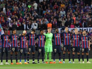 Barcelona's players line up before the start of the Spanish league football match between FC Barcelona and Real Sociedad at the Camp Nou stadium in Barcelona on May 20, 2023. (Photo by Lluis GENE / AFP)