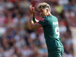 Liverpool's Brazilian striker Roberto Firmino applauds fans as he leaves on his final Liverpool appearance during the English Premier League football match between Southampton and Liverpool at St Mary's Stadium in Southampton, southern England on May 28, 2023. (Photo by Adrian DENNIS / AFP) 