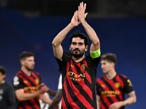 Manchester City's German midfielder Ilkay Gundogan applauds at the end of the UEFA Champions League semi-final first leg football match between Real Madrid CF and Manchester City at the Santiago Bernabeu stadium in Madrid on May 9, 2023. (Photo by JAVIER SORIANO / AFP)