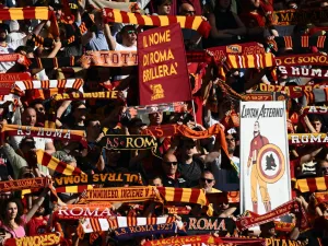 AS Rome fans cheer prior to the Italian Serie A football match between AS Rome and Inter Milan on May 6, 2023 at the Olympic stadium in Rome. (Photo by Vincenzo PINTO / AFP)