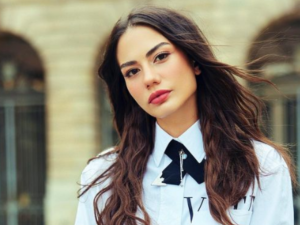 Özdemir raises temperatures as she wears a sexy revealing dress. 