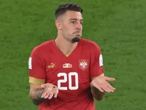 Serbia's midfielder #20 Sergej Milinkovic-Savic reacts after receiving a yellow card during the Qatar 2022 World Cup Group G football match between Serbia and Switzerland at Stadium 974 in Doha on December 2, 2022. (Photo by Patrick T. Fallon / AFP)