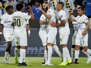Ittihad's French forward Karim Benzema (C) celebrates with teammates after scoring his team's second goal during the 2023 Arab Club Champions Cup group A football match between Tunisia's Esperance de Tunis and Saudi Arabia's Al-Ittihad at the King Fahd Stadium in Taif on July 27, 2023. (Photo by AFP)