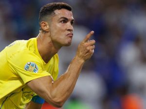 Nassr's Portuguese forward #07 Cristiano Ronaldo celebrates scoring his team's first goal during the 2023 Arab Club Champions Cup final football match between Saudi Arabia's Al-Hilal and Al-Nassr at the King Fahd Stadium in Taif on August 12, 2023. (Photo by AFP)