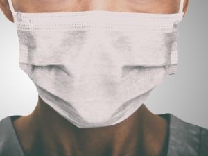 Doctor wearing protection face mask against coronavirus