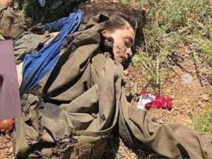 جثة مقاتلة كردية على جبهة بلدة ذيبان