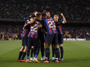 Barcelona's players celebrate their team first goal during the Spanish league football match between FC Barcelona and Real Betis at the Camp Nou stadium in Barcelona on April 29, 2023. (Photo by Josep LAGO / AFP)