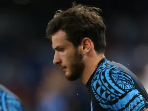 Napoli's Georgian forward #77 Khvicha Kvaratskhelia warms up prior to the Italian Serie A football match between SSC Napoli and SS Lazio at the Diego Armando Maradona Stadium on September 2, 2023. (Photo by CARLO HERMANN / AFP)