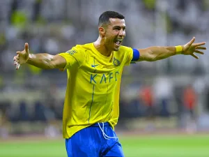 Nassr's Portuguese forward #07 Cristiano Ronaldo celebrates after scoring during the Saudi Pro League football match between Al-Nassr and Al-Fateh at the Prince Abdullah Bin Jalawi Stadium in al-Hasa, on August 25, 2023. (Photo by Ali Al-HAJI / AFP)