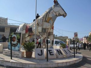 statue made of ambulances remains