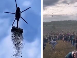 Man in helicopter throws $1 million to people. (Social media) helicopter
