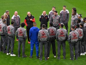 AC Milan's Italian coach Stefano Pioli (back 3L) talks to his players during their walk on the pitch on the eve of their UEFA Champions League football match between Borussia Dortmund and AC Milan at the Signal Iduna Park stadium in Dortmund, western Germany on October 3, 2023. (Photo by Ina FASSBENDER / AFP)