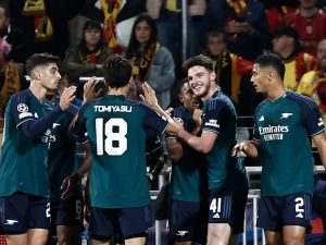 Arsenal's Brazilian striker #09 Gabriel Jesus (C) celebrates with teammates after scoring the opening goal during the UEFA Champions League Group B first leg football match between RC Lens and Arsenal FC at the Bollaert Stadium in Lens, northern France, on October 3, 2023. (Photo by Sameer Al-Doumy / AFP)