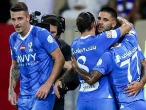 Hilal's players celebrate with Serbian forward #09 Aleksandar Mitrovic after he scored a goal during the Saudi Pro League football match between Al-Ittihad and Al-Hilal at Prince Abdullah al-Faisal Stadium in Jeddah on September 1, 2023. (Photo by AFP)