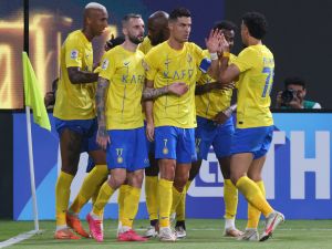 Nassr's Portuguese forward #07 Cristiano Ronaldo celebrates with teammates after their third goal during the AFC Champions League group E football match between Saudi al-Nassr SC and Tajikistan's FC Istiklol at King Saud University Stadium in Riyadh on October 2, 2023. (Photo by Fayez NURELDINE / AFP)