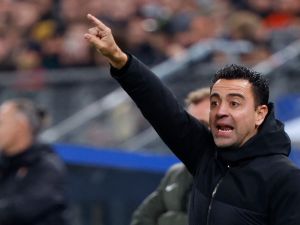 تشافي هيرنانديز (Photo by Axel Heimken / AFP)
