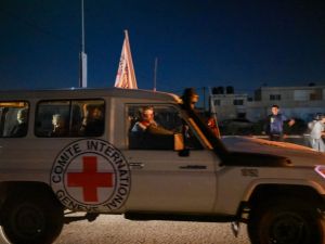 An International Red Cross vehicle carrying Israeli hostages released by Hamas crosses the Rafah border point in the Gaza Strip. (Mohammed Abed/ AFP)