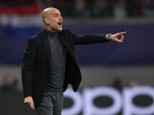 Manchester City's Spanish manager Pep Guardiola gestures during the UEFA Champions League Group G football match between RB Leipzig and Manchester City in Leipzig, eastern Germany on October 4, 2023. (Photo by Ronny HARTMANN / AFP)