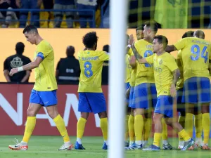 Nassr's Portuguese forward #07 Cristiano Ronaldo and teammates celebrate after he scored a goal during the AFC Champions League Group E football match between Saudi's al-Nassr and Qatar’s al-Duhail at the King Saud University Stadium in Riyadh on October 24, 2023. (Photo by Fayez NURELDINE / AFP)