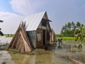 The "Khudi Bari" or "tiny house" -- resilient homes made on bamboo stilts rising out of the floodwaters that are also easy to move to safer locations when needed -- offer hope to millions. (Photo by Munir UZ ZAMAN / AFP) Bangladesh