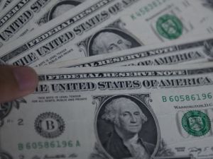 Dollar retreats as fed signals end of rate hike cycle