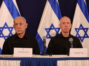 Israeli Prime Minister Benjamin Netanyahu (L) and Defence Minister Yoav Gallant attend a press conference in the Kirya military base in Tel Aviv on October 28, 2023 amid ongoing battles between Israel and the Palestinian group Hamas. 