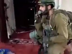 Israeli soldiers sing, dance and recite a Jewish prayer inside a mosque in West Bank. (X)