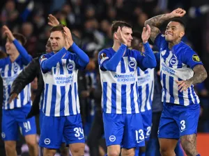 Brighton's players celebrate on the pitch after the UEFA Europa League Group B football match between Brighton and Hove Albion and Marseille at the American Express Community Stadium in Brighton, southern England on December 14, 2023. Brighton won the game 1-0 and top the Group. (Photo by Glyn KIRK / AFP)