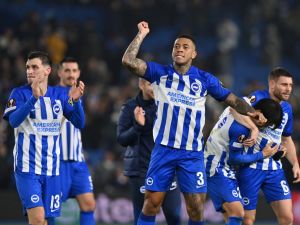 Brighton's Brazilian defender #03 Igor Julio (C) and teammates celebrate on the final whistle in the UEFA Europa League Group B football match between Brighton and Hove Albion and Marseille at the American Express Community Stadium in Brighton, southern England on December 14, 2023. Brighton won the game 1-0 and top the Group. (Photo by Glyn KIRK / AFP)