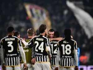 Juventus' Italian defender #04 Federico Gatti celebrates with teammates after winning the Italian Serie A football match between Juventus and Napoli, at The Allianz Stadium, in Turin on December 8, 2023. (Photo by Marco BERTORELLO / AFP)