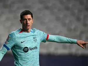 Barcelona's Polish forward #09 Robert Lewandowski gestures during the UEFA Champions League Group H football match between Royal Antwerp FC and FC Barcelona at the Bosuilstadion in Antwerp, on December 13, 2023. (Photo by JOHN THYS / AFP)