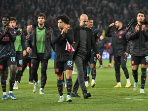 Manchester City's Spanish manager Pep Guardiola (Centre R) and Manchester City players celebrate after winning the UEFA Champions League Group G day 6 group stage football match between Crvena Zvezda (Red Star Belgrade) and Manchester City at the Red Star stadium in Belgrade, on December 13, 2023. (Photo by ANDREJ ISAKOVIC / AFP)