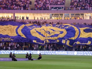 Al-Nassr fans cheer ahead of the Saudi Pro League football match between Al-Ittihad and Al-Nassr at King Abdullah Sports City Stadium in Jeddah on December 26, 2023. (Photo by AFP)