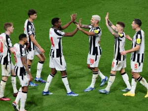 Newcastle United's Swedish striker #14 Alexander Isak (C-L) celebrates with Newcastle United's Brazilian midfielder #39 Bruno Guimaraes (C-R) and teammates after opening the scoring during the UEFA Champions League 1st round, day 5, Group F football match between Paris Saint-Germain (PSG) and Newcastle United at the Parc des Princes stadium in Paris, on November 28, 2023. (Photo by Alain JOCARD / AFP)