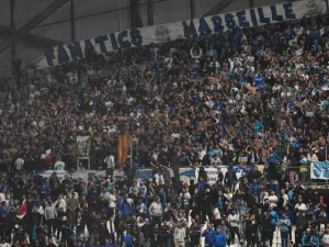 Marseille's supporters react at the Stade Velodrome in Marseille, southern France on October 29, 2023, after the French Ligue 1 football match between Marseille and Lyon was postponed after the Lyon's travelling team bus was attacked with stones as it entered the Stade Velodrome ahead of the match. Lyon former coach Fabio Grosso and his assistant were injured during the attack. (Photo by Christophe SIMON / AFP)