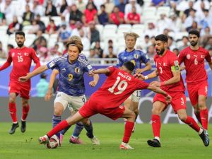 اليابان تطيح بالبحرين خارج البطولة (Photo by Giuseppe CACACE / AFP)