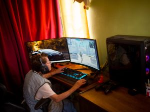 81-year-old María Elena Arévalo plays Free Fire, a popular online video game, at home at her home in Llay-Llay, Valparaiso Region, Chile. (Photo by Pablo Vera / AFP) gaming