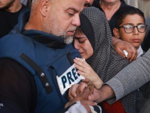 Al Jazeera journalist, Wael al-Dahdouh, escapes Gaza after losing family and colleague in Israeli strikes. (AFP)