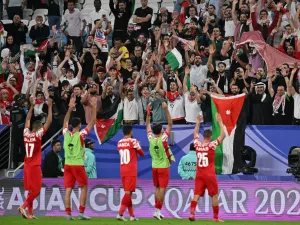 Jordan's players salute the attendance after the end of the Qatar 2023 AFC Asian Cup Group E football match between Malaysia and Jordan at the Al-Janoub Stadium in Al-Wakrah, south of Doha on January 15, 2024. (Photo by HECTOR RETAMAL / AFP)