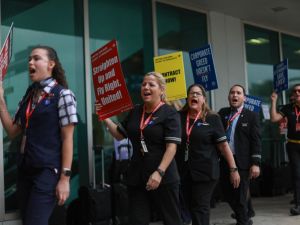 Flight attendants protest as over two-thirds of flight attendants in the US are currently in new union contract negotiations. (Joe Raedle/ AFP)