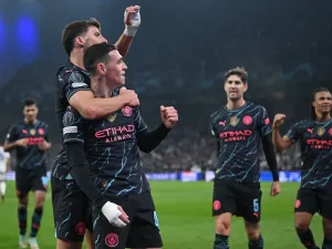 Manchester City's English midfielder #47 Phil Foden celebrates with Manchester City's Portuguese defender #03 Ruben Dias scoring during the UEFA Champions League round of 16, first-leg football match between FC Copenhagen and Manchester City in Copenhagen, Denmark, on February 13, 2024. (Photo by Jonathan NACKSTRAND / AFP)