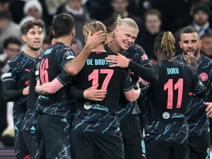 Manchester City's players celebrate during the UEFA Champions League round of 16, first-leg football match between FC Copenhagen and Manchester City in Copenhagen, Denmark, on February 13, 2024. (Photo by Jonathan NACKSTRAND / AFP)