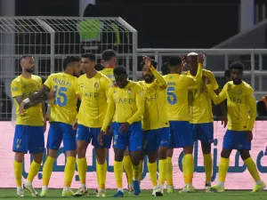 Nassr's players celebrate their team's third goal during the Saudi Pro League football match between Al-Shabab and Al-Nassr at the Al-Shabab Club Stadium in Riyadh on February 25, 2024. (Photo by Fayez NURELDINE / AFP)
