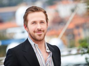 Ryan Gosling and Emily Blunt arrive at the SXSW premiere of The Fall Guy on the back of a pickup truck.