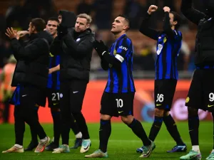Inter Milan’s forward Lautaro Martinez from Argentina (C) elebrates at the end the Italian Serie A football match Inter Milan vs Udinese on December 9, 2023 at the “San Siro Stadium” in Milan. (Photo by MARCO BERTORELLO / AFP)