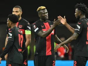 Bayer Leverkusen's Nigerian forward #22 Victor Boniface (2R) celebrates scoring his team's second goal with Bayer Leverkusen's Burkinabe defender #12 Edmond Tapsoba (R) and teammates Bayer Leverkusen's German defender #04 Jonathan Tah (2L) and Bayer Leverkusen's English midfielder #19 Nathan Tella during the UEFA Europa League quarter-final first leg football match between Bayer 04 Leverkusen and West Ham United FC in Leverkusen, western Germany on April 11, 2024. (Photo by INA FASSBENDER / AFP)