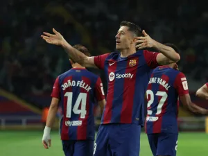 Barcelona's Polish forward #09 Robert Lewandowski celebrates after scoring his team's third goal during the Spanish league football match between FC Barcelona and Valencia CF at the Estadi Olimpic Lluis Companys in Barcelona on April 29, 2024. (Photo by LLUIS GENE / AFP)