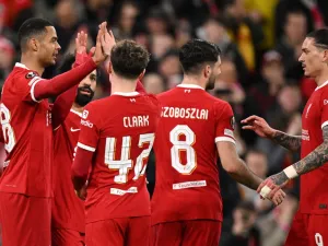 Liverpool's Dutch striker #18 Cody Gakpo (L) celebrates scoring the team's fourth goal with Liverpool's Egyptian striker #11 Mohamed Salah, Liverpool's English midfielder #42 Bobby Clark and Liverpool's Uruguayan striker #09 Darwin Nunez during the UEFA Europa League round of 16 second leg football match between Liverpool and AC Sparta Praha at Anfield in Liverpool, north west England on March 14, 2024. (Photo by Oli SCARFF / AFP)